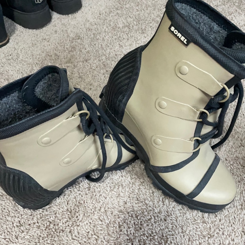 Tan and black Sorel rain boots
